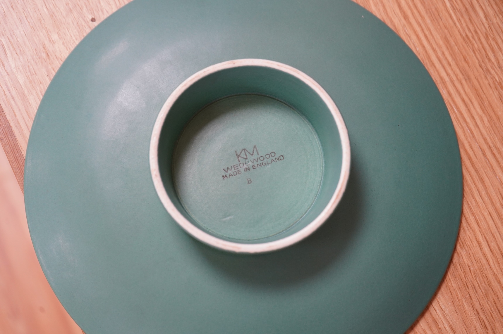 Keith Murray for Wedgwood, a green glazed ribbed tazza or footed dish, 23cm in diameter